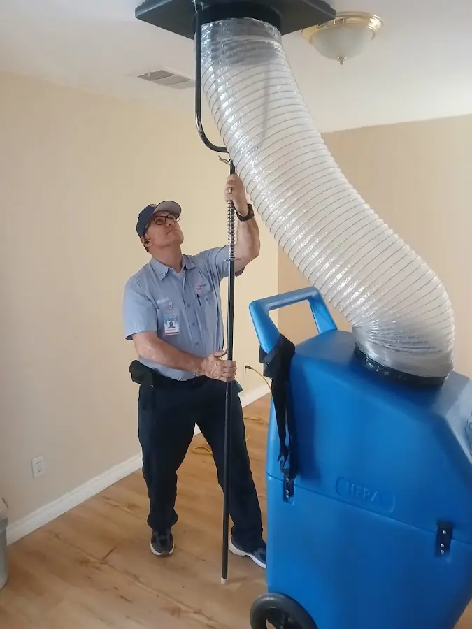 Furnace Tune-Up technician using HEPA equipment in Waukegan